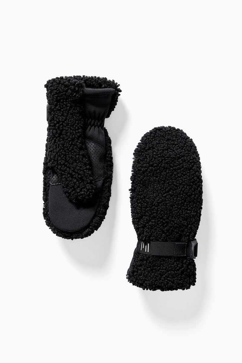 A pair of Holden Sherpa mittens featuring black fleece and a textured, fluffy exterior; one mitten reveals the faux fur lining on the palm, while the other shows the back.