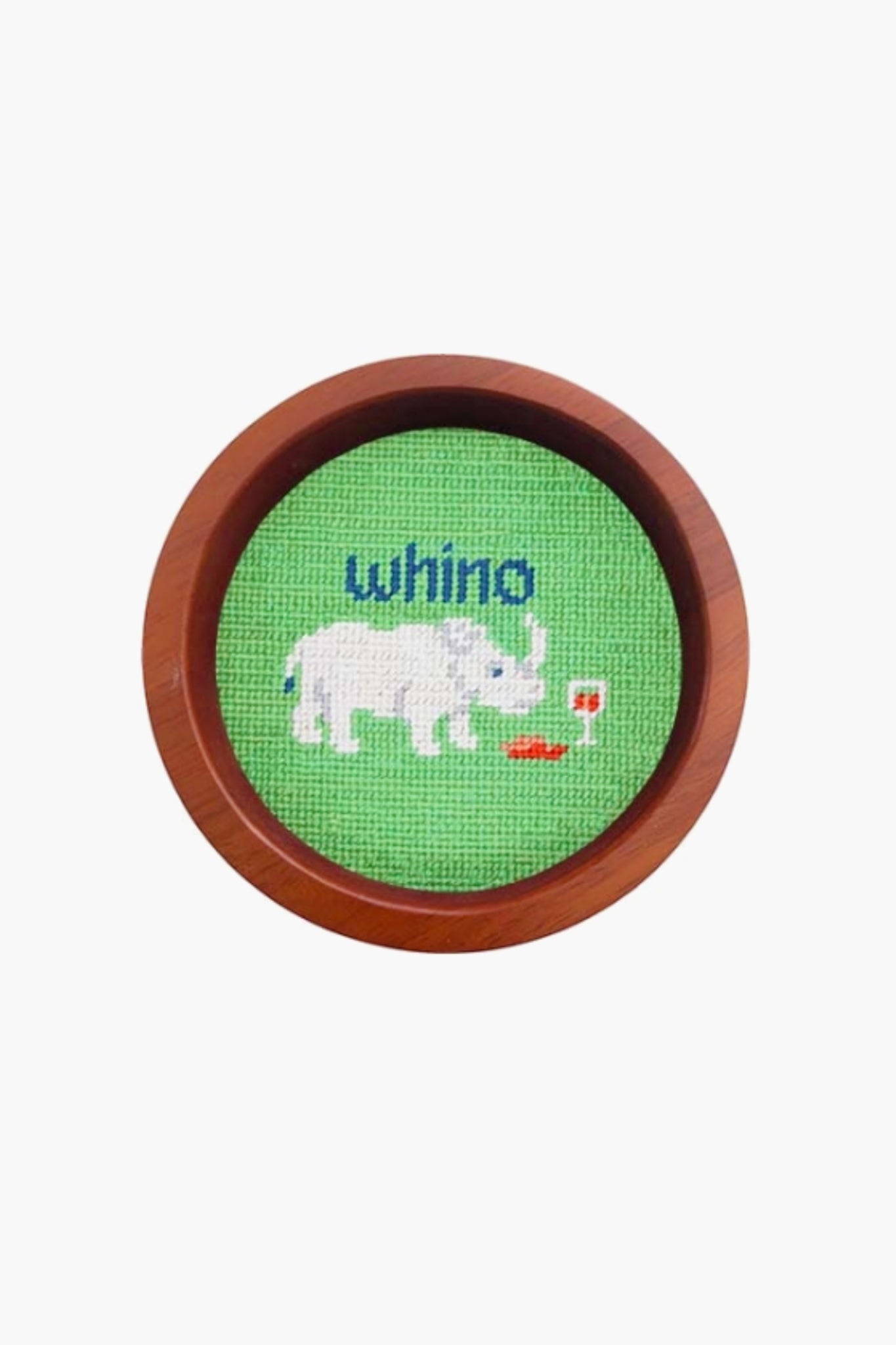 This round, hand-stitched needlepoint by Smathers and Branson features a white rhinoceros beside a glass of red wine with "whino" above, making it a unique wine gift or wine bottle coaster in a wooden frame.