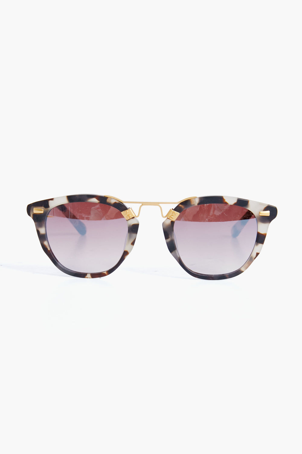 KREWE du optic tortoiseshell handcrafted sunglasses feature round gradient-tinted lenses and a 24K gold-plated bridge, adding a luxurious touch to classic tortoise shades.