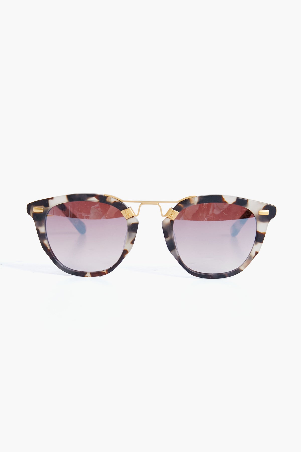KREWE du optic tortoiseshell handcrafted sunglasses feature round gradient-tinted lenses and a 24K gold-plated bridge, adding a luxurious touch to classic tortoise shades.