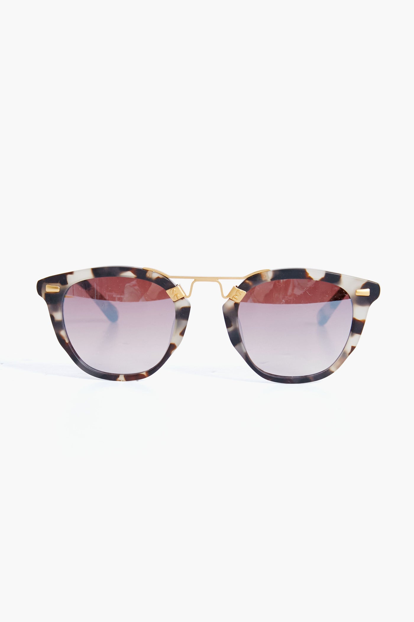 KREWE du optic tortoiseshell handcrafted sunglasses feature round gradient-tinted lenses and a 24K gold-plated bridge, adding a luxurious touch to classic tortoise shades.