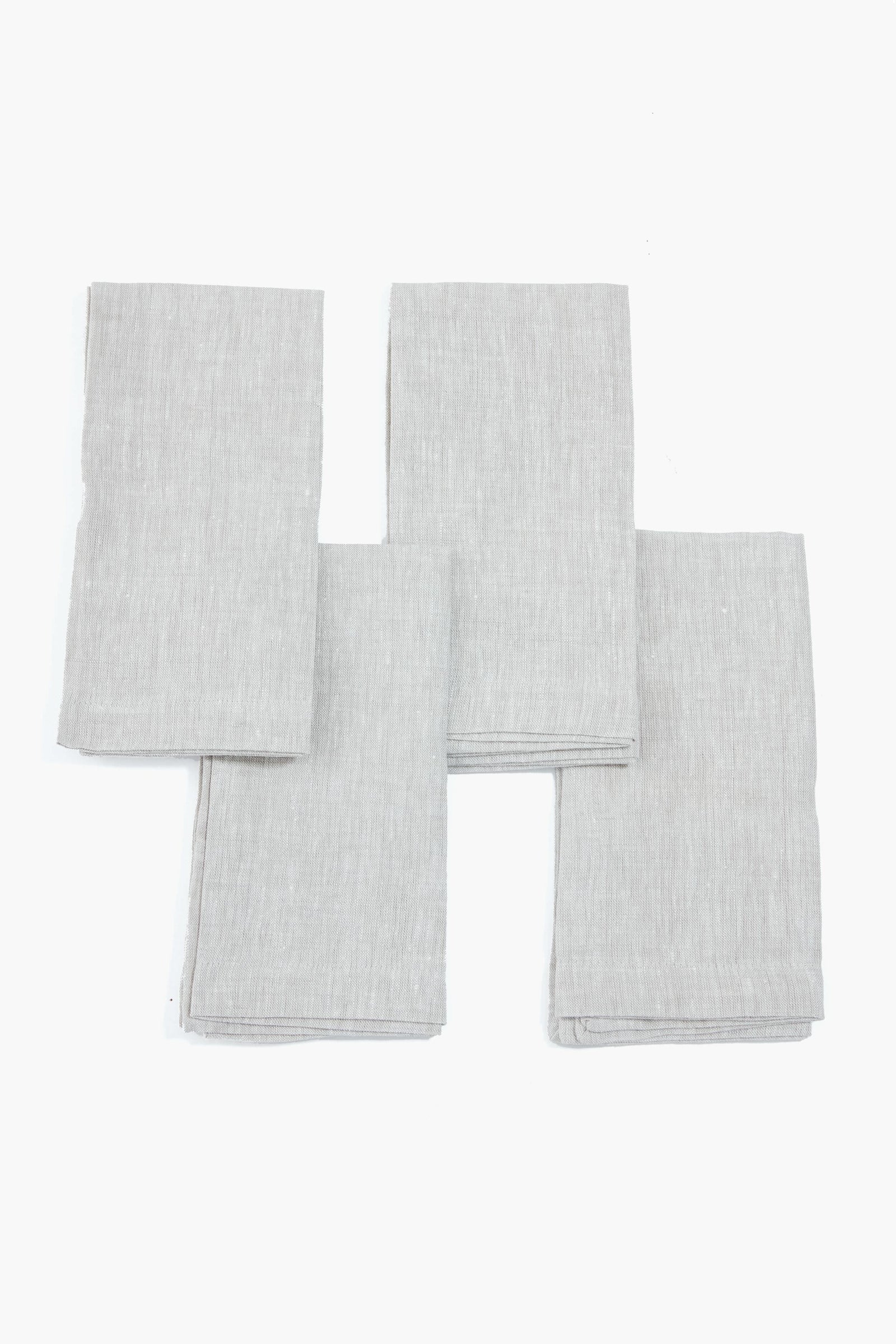 Stone Washed Linen Napkins set of four, neatly folded, showcasing classic, effortless elegance for fun, high-end dining experiences, perfect for any meal occasion.