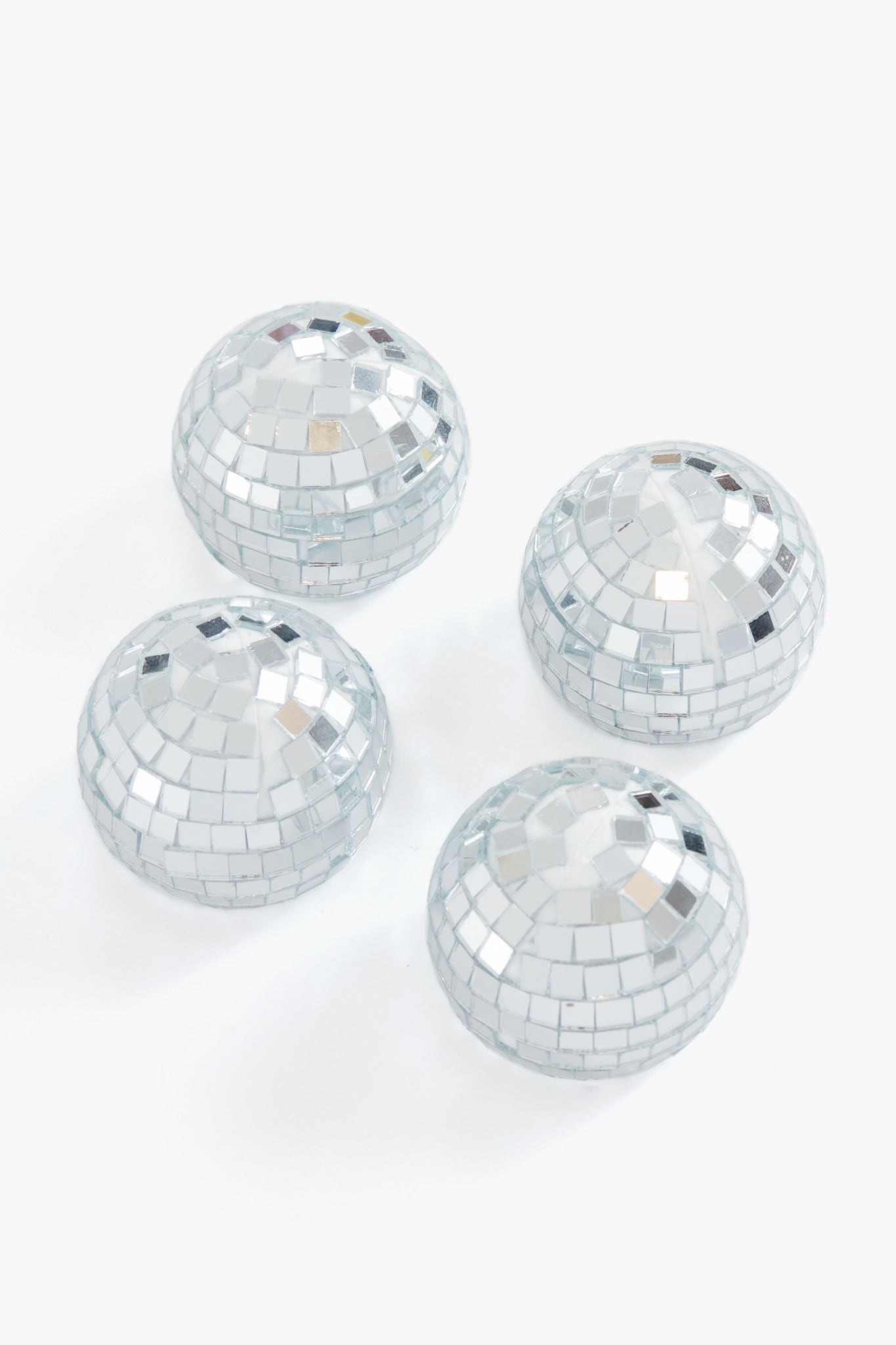 Chefanie’s set of four small, dome-shaped placecard holders, covered in silver mirror tiles like mini disco balls, add a fun and festive touch to your next dinner party decor.