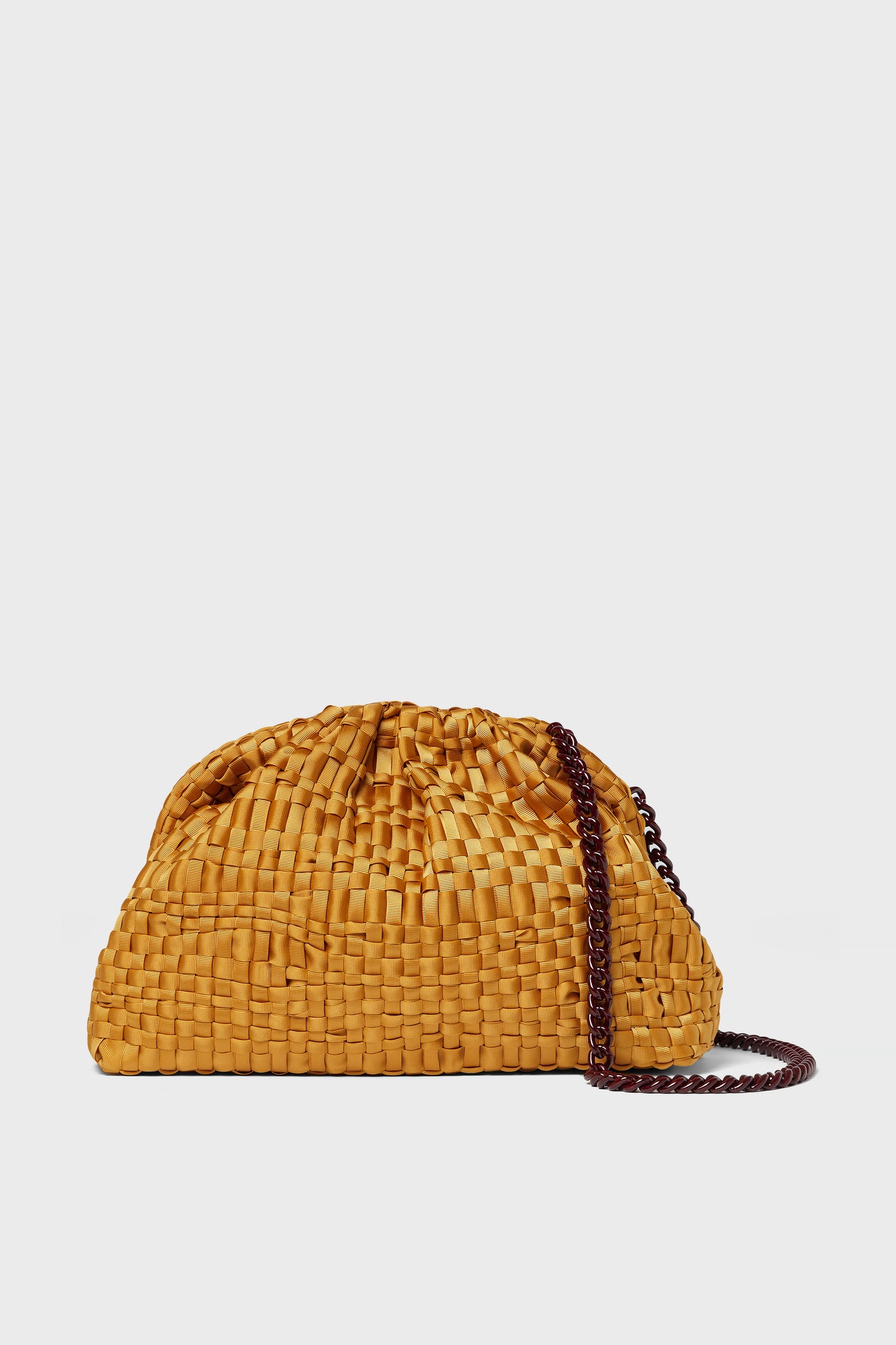 A yellow handwoven Game Clutch by Maria La Rosa features a gathered top, dark chain shoulder strap, and showcases Italian craftsmanship.
