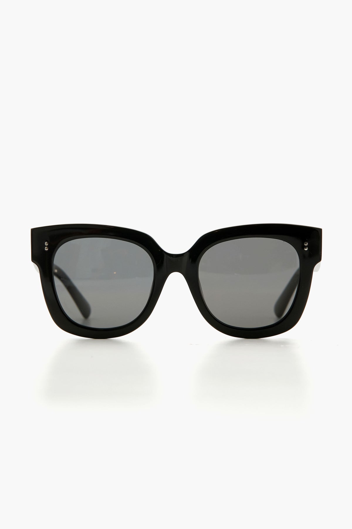 Chimi black oversized sunglasses with thick frames and dark lenses, crafted from Italian acetate and featuring a sleek rectangular design.