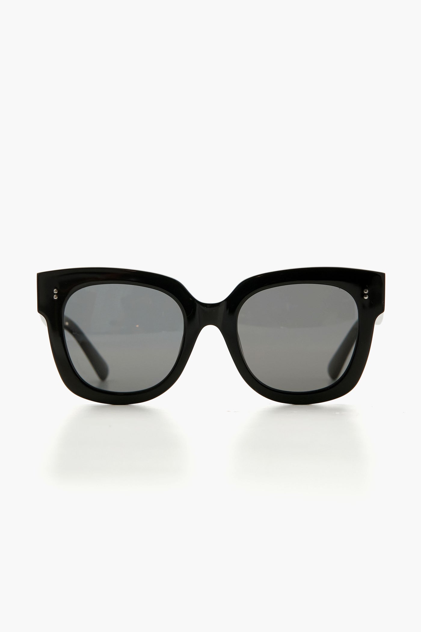 Chimi black oversized sunglasses with thick frames and dark lenses, crafted from Italian acetate and featuring a sleek rectangular design.