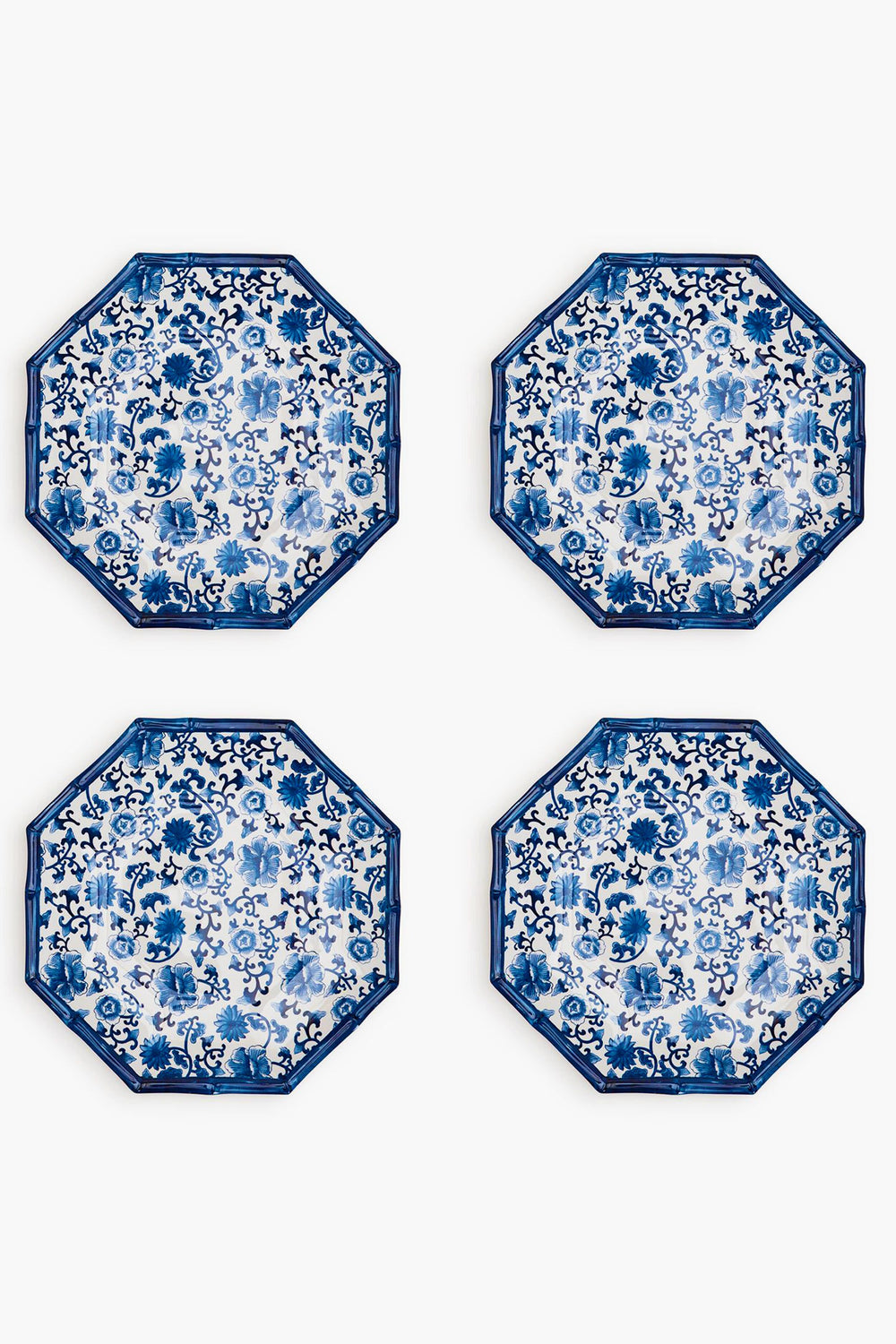 Four octagon-shaped melamine plates by Two's Company feature blue and white floral patterns, arranged in a two-by-two grid. These shatter-resistant plates add both elegance and durability to your table setting.