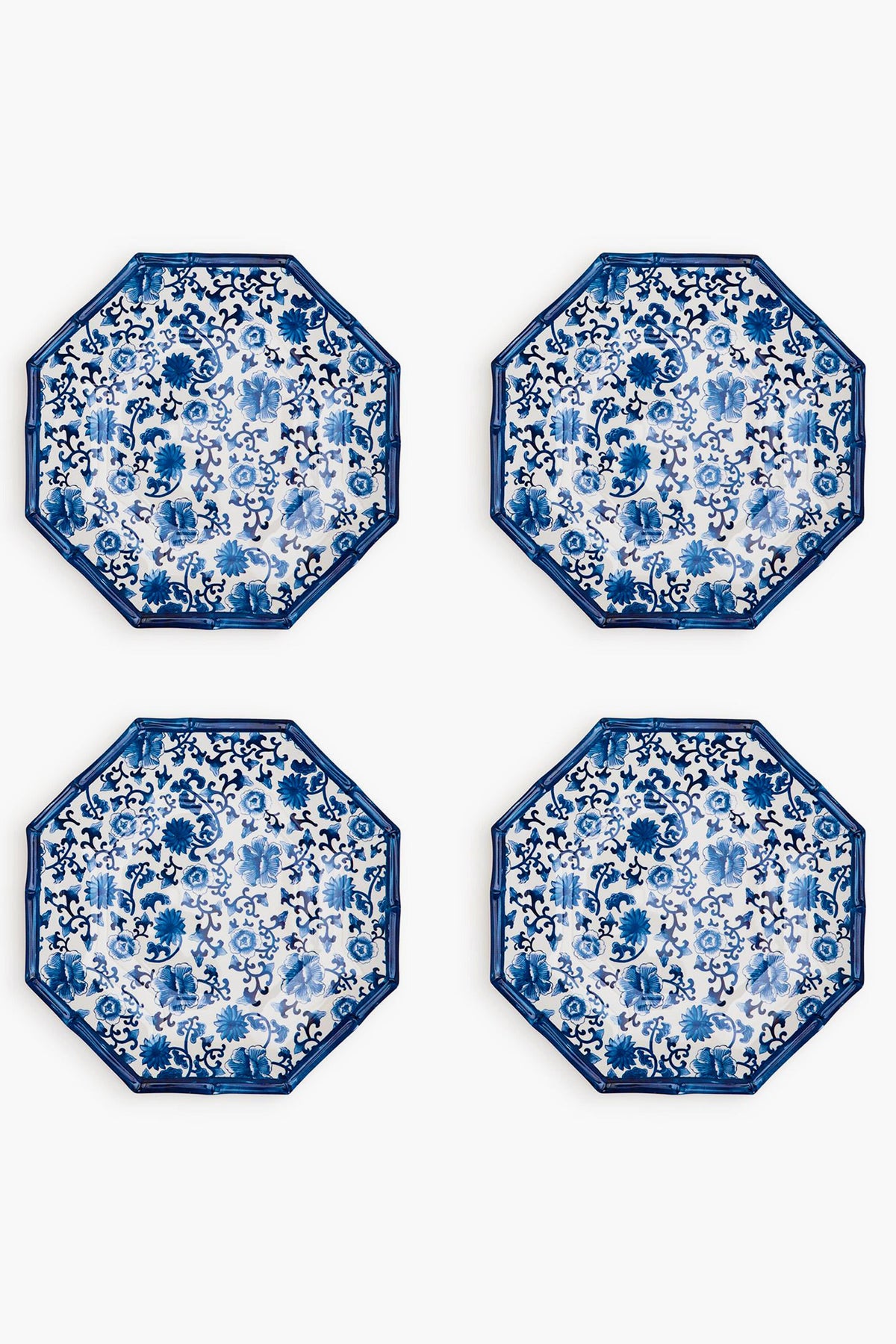Four octagon-shaped melamine plates by Two's Company feature blue and white floral patterns, arranged in a two-by-two grid. These shatter-resistant plates add both elegance and durability to your table setting.