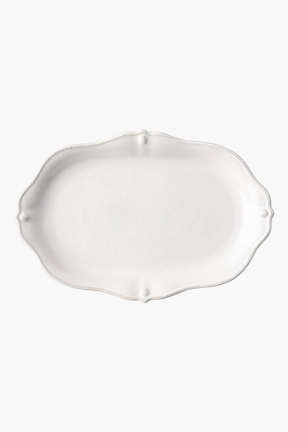 Juliska's empty, white oval ceramic stoneware platter features a scalloped edge and subtle embossed detailing—perfect for adding elegance to your dinnerware collection.