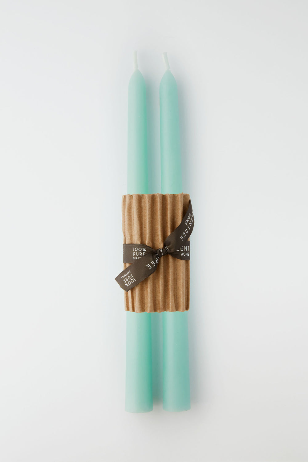 Two Greentree Home Robins Egg Blue hand-poured candles are bundled together with a corrugated cardboard sleeve and finished with a brown ribbon.