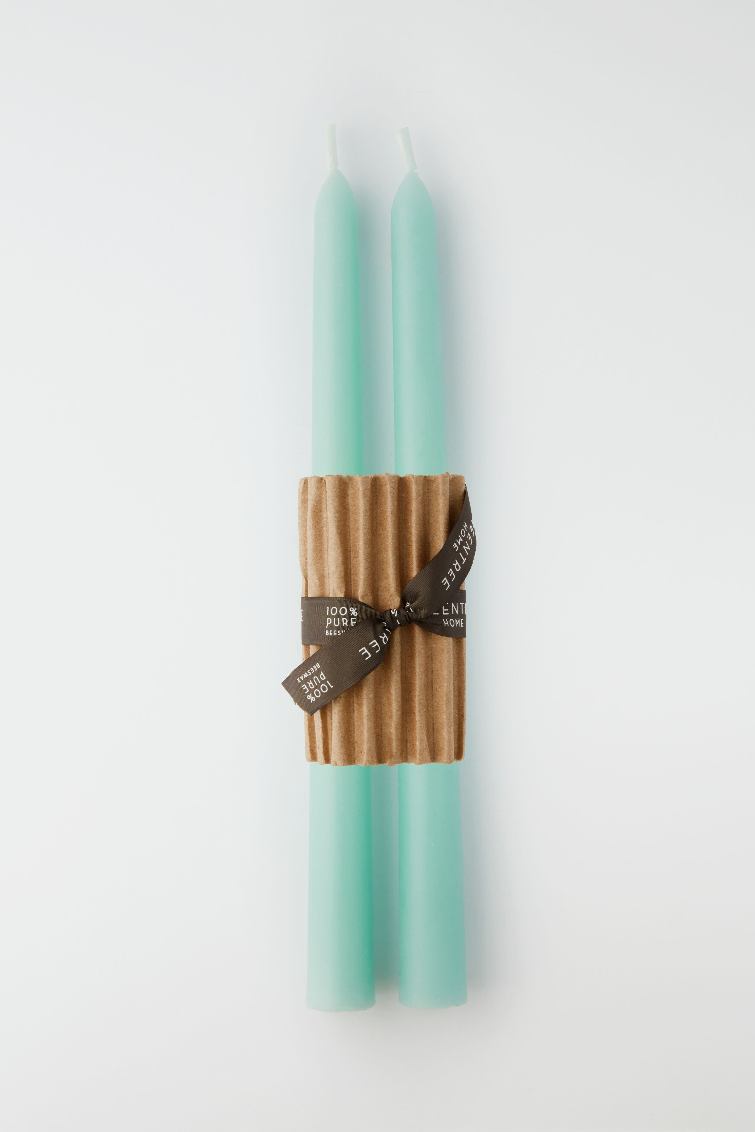 Two Greentree Home Robins Egg Blue hand-poured candles are bundled together with a corrugated cardboard sleeve and finished with a brown ribbon.