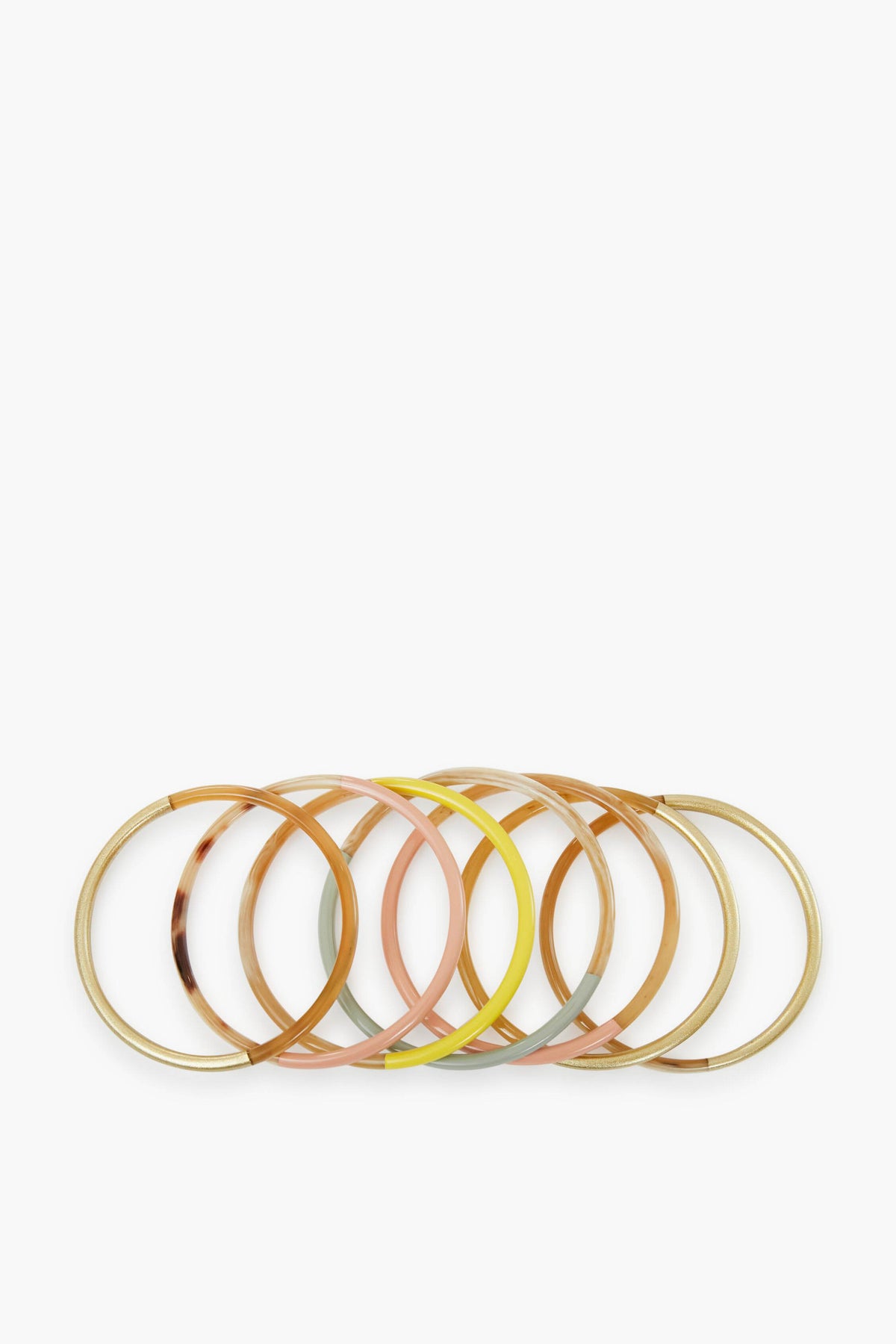 Six colorful bangles with gold accents, part of the Exclusive Sunset Bangle Stack by Sunshine Tienda x Ashley Brooke—artisan-crafted from cruelty-free buffalo horn.