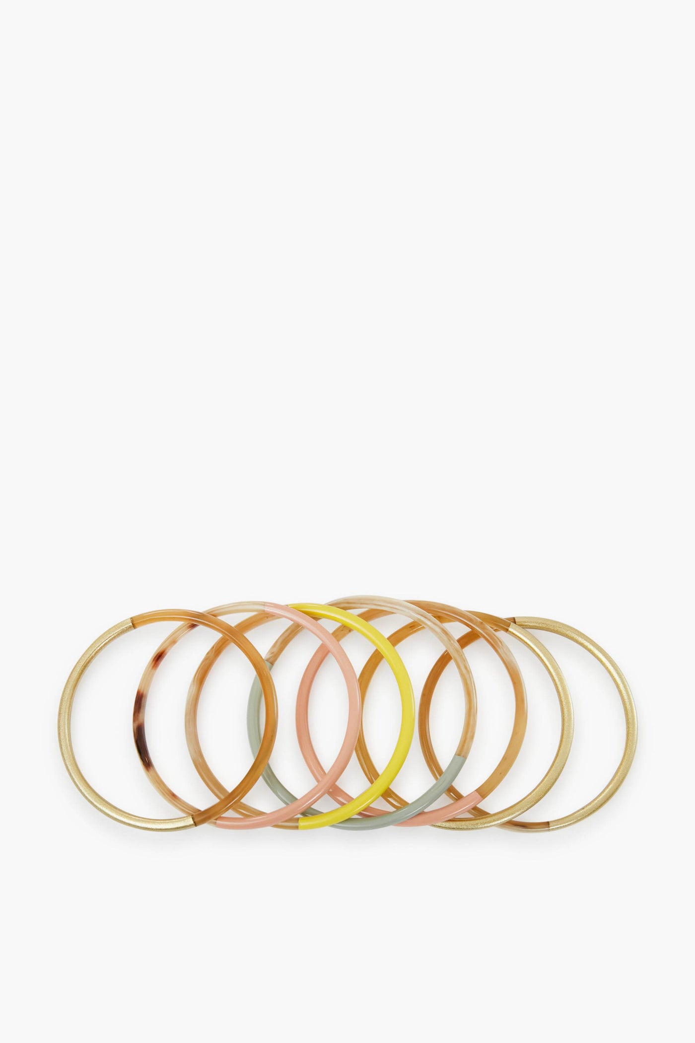 Six colorful bangles with gold accents, part of the Exclusive Sunset Bangle Stack by Sunshine Tienda x Ashley Brooke—artisan-crafted from cruelty-free buffalo horn.