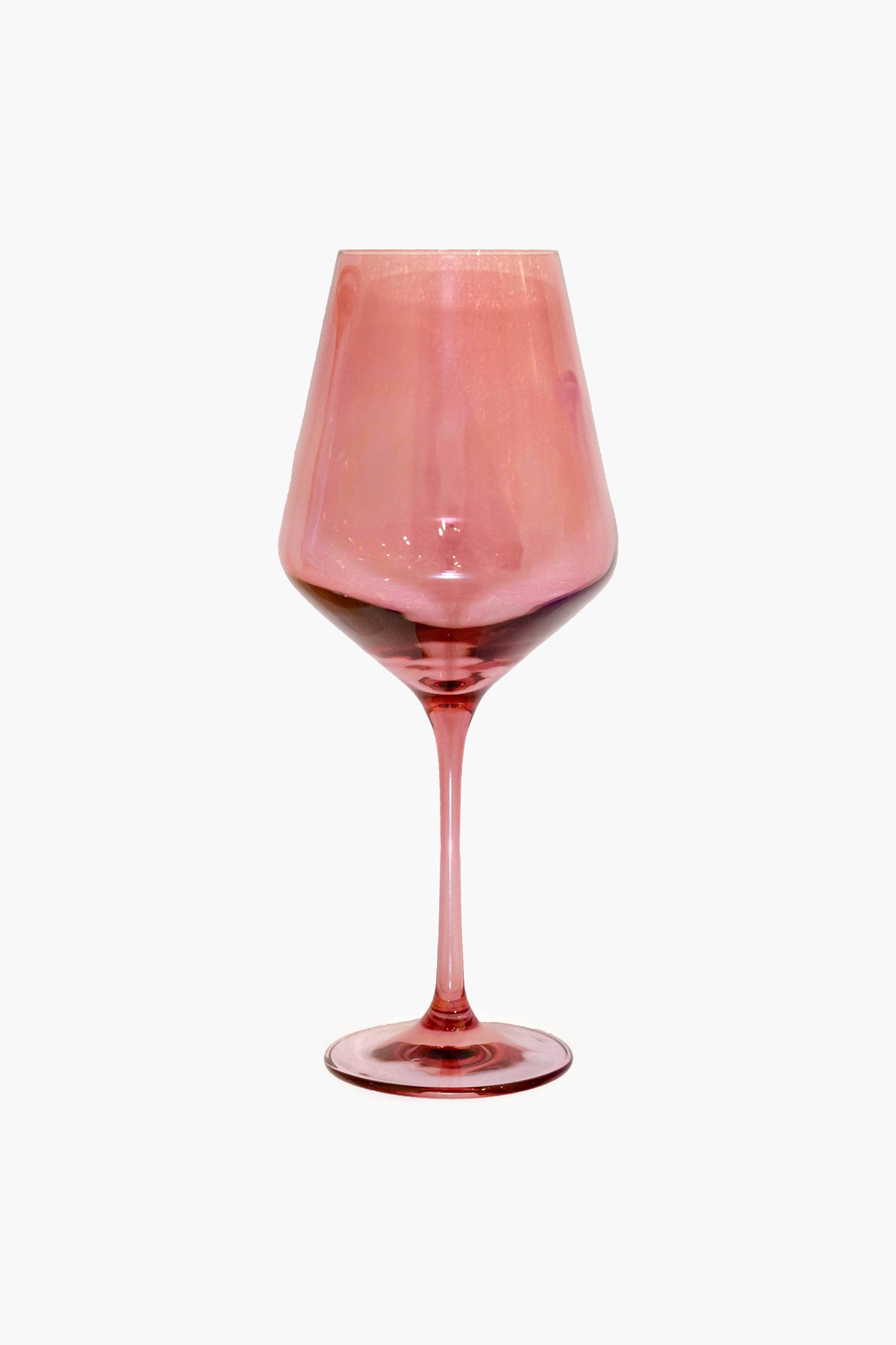 The Estelle Colored Glass pink-tinted hand-blown wine glass features a wide bowl and thin stem, perfect for those who appreciate luxury stemware.
