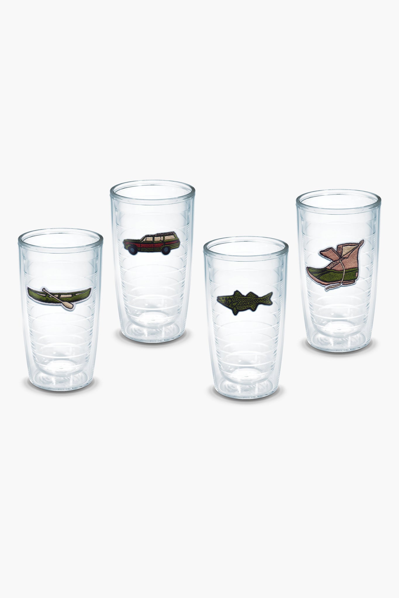 Four clear Tervis Tumbler x Tuckernuck tumblers, each featuring a unique embroidered patch—a canoe, car, fish, and boot—are arranged in a row. Their BPA-free double-wall design keeps drinks at the perfect temperature.