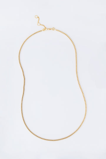 The Tuckernuck Jewelry gold box chain necklace features a small clasp and adjustable links, making it a chic and versatile addition to your jewelry collection.