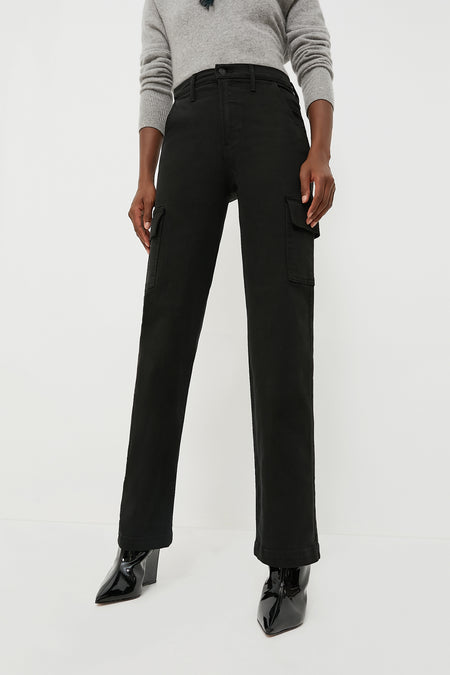 Someone wears a grey sweater, MOTHER high rise wide leg cargo jeans in soft stretch denim with side pockets, and black pointed-toe ankle boots.