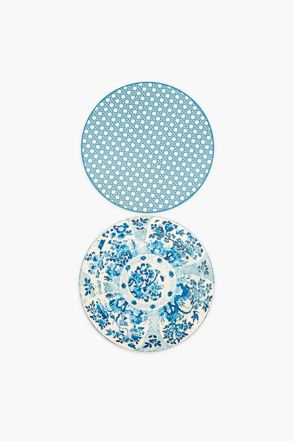 Two round plates from Holly Stuart Home with blue and white designs—the top has a geometric pattern, the bottom a floral motif—ideal as inspiration for handcrafted placemats or as a thoughtful hostess gift.