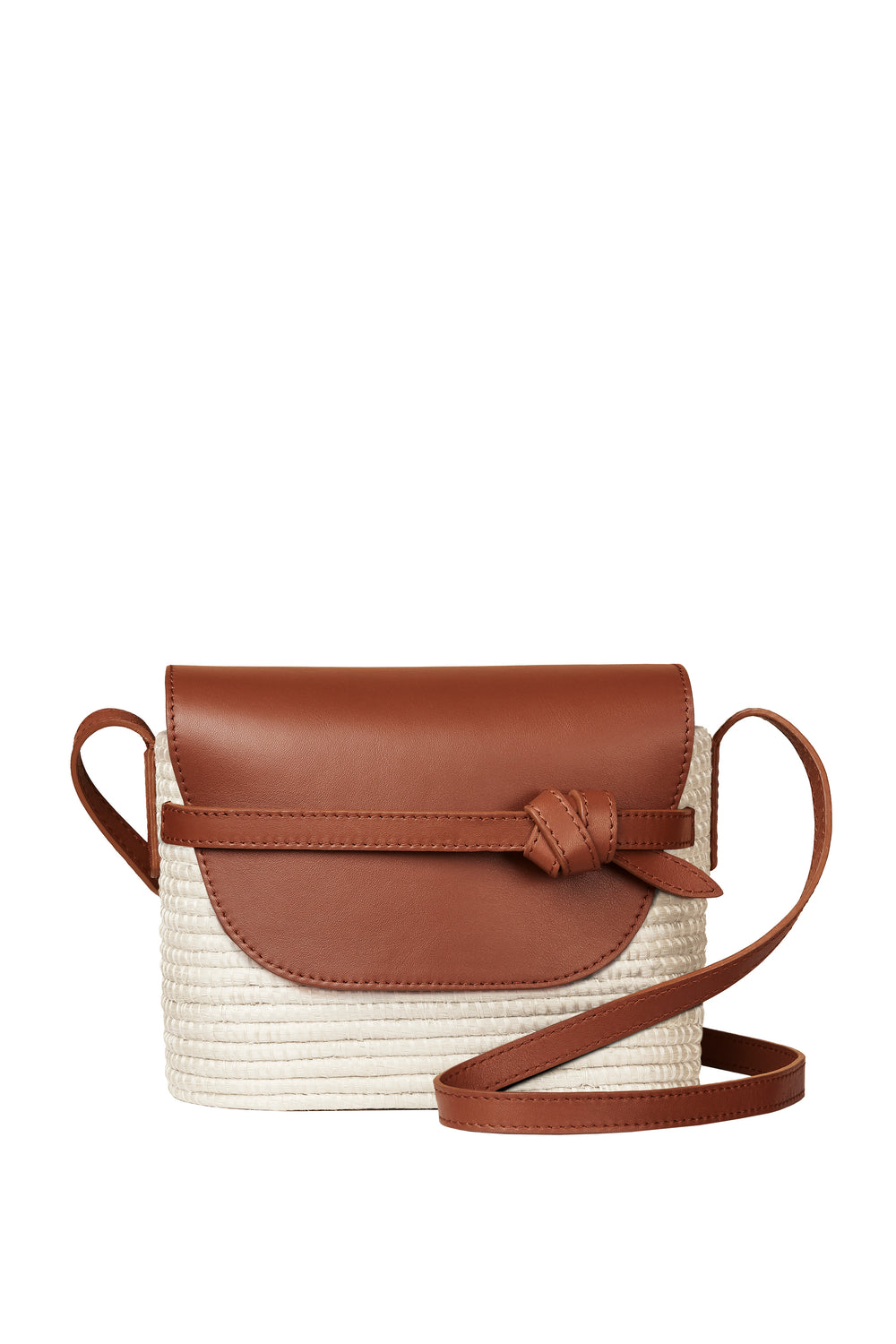 Cesta Collective crossbody bag featuring a brown leather flap and strap, front knotted detail, and a woven beige base inspired by handwoven baskets crafted by female artisans in Rwanda.