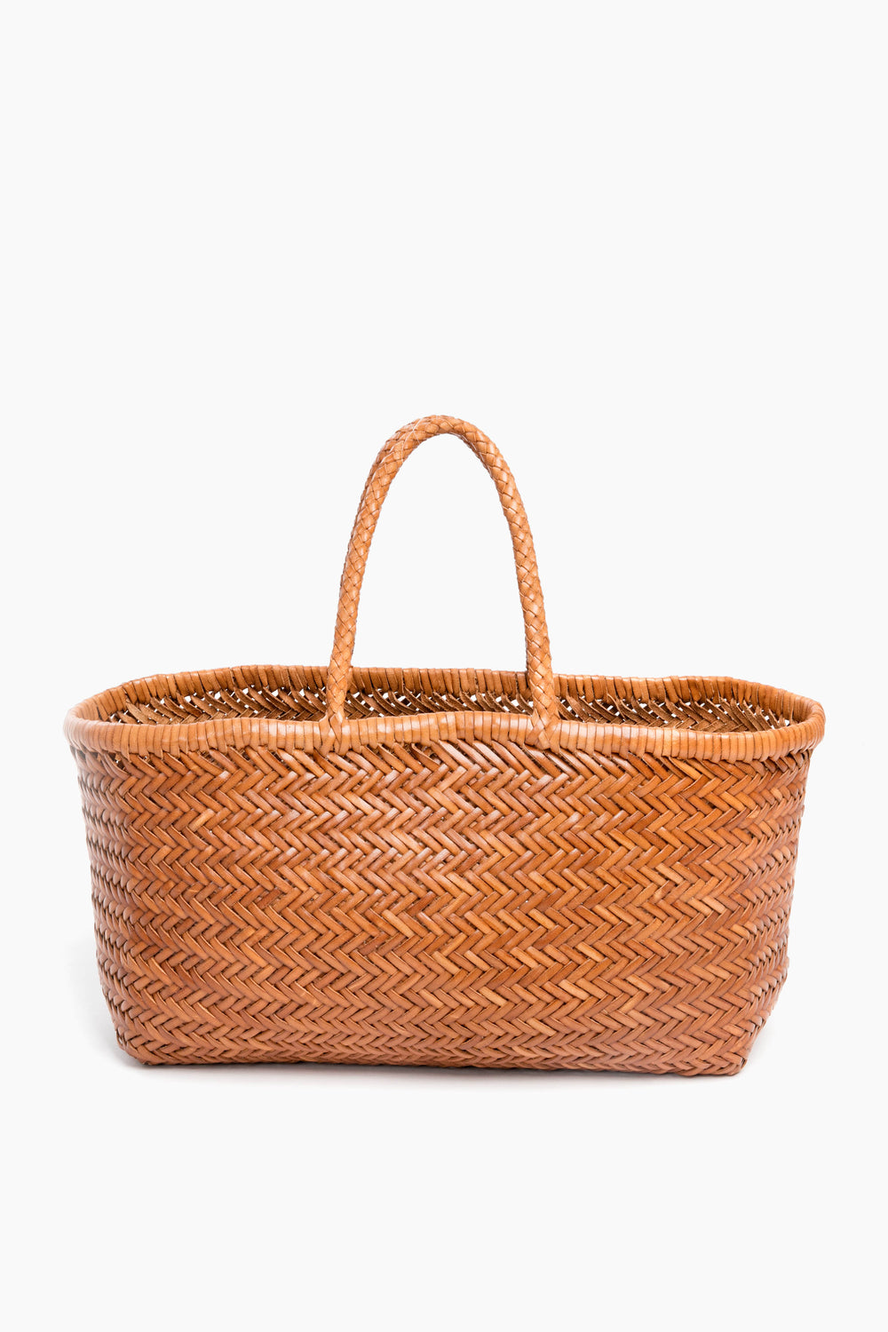 A handcrafted brown woven basket by Dragon Diffusion, made in India from buffalo calf leather and featuring two handles.
