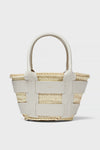 The Demellier woven straw raffia bag features wide white leather straps and handles, making it a chic mini tote perfect for everyday use.