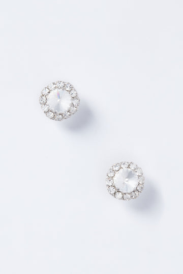 Handmade in New York, these luxury Jennifer Behr earrings feature round Swarovski crystal studs with a central clear gemstone surrounded by a halo of smaller stones.