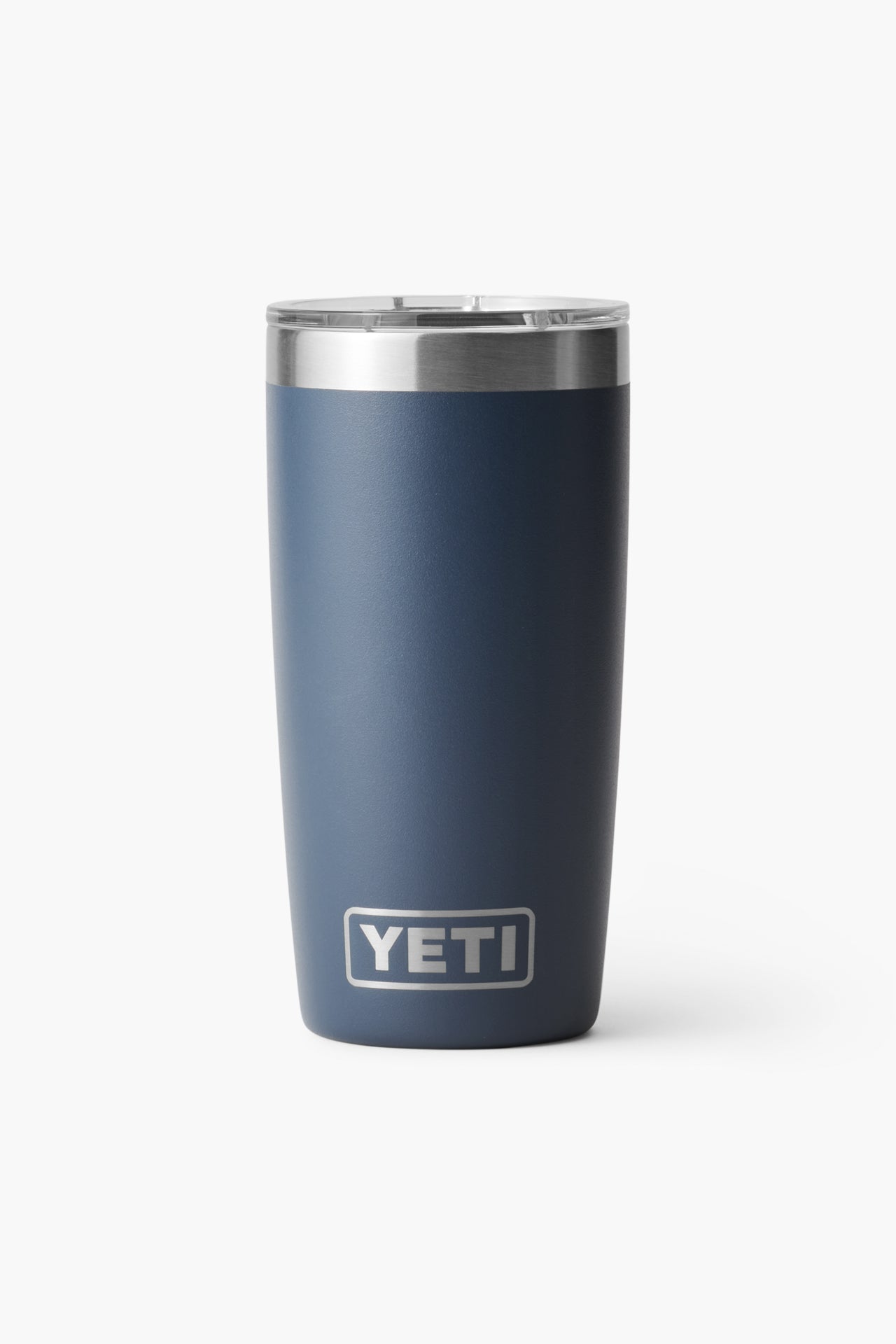 A navy blue YETI Rambler Tumbler with a stainless steel rim and clear lid, featuring the YETI logo. The vacuum-insulated cup keeps beverages at the ideal temperature.