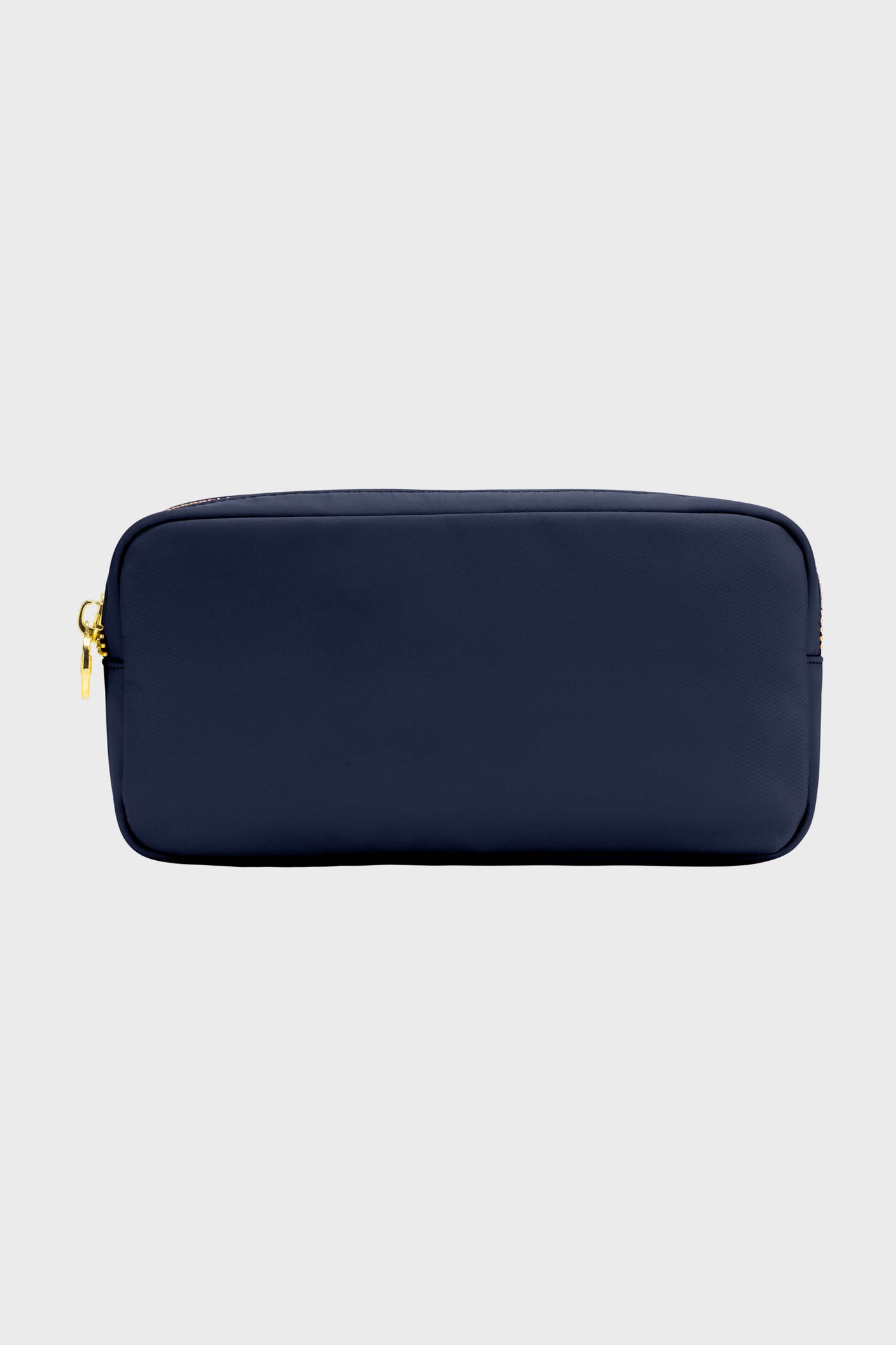 The Stoney Clover Lane rectangular navy blue zippered makeup bag features a gold zipper, making it perfect for travel accessories.