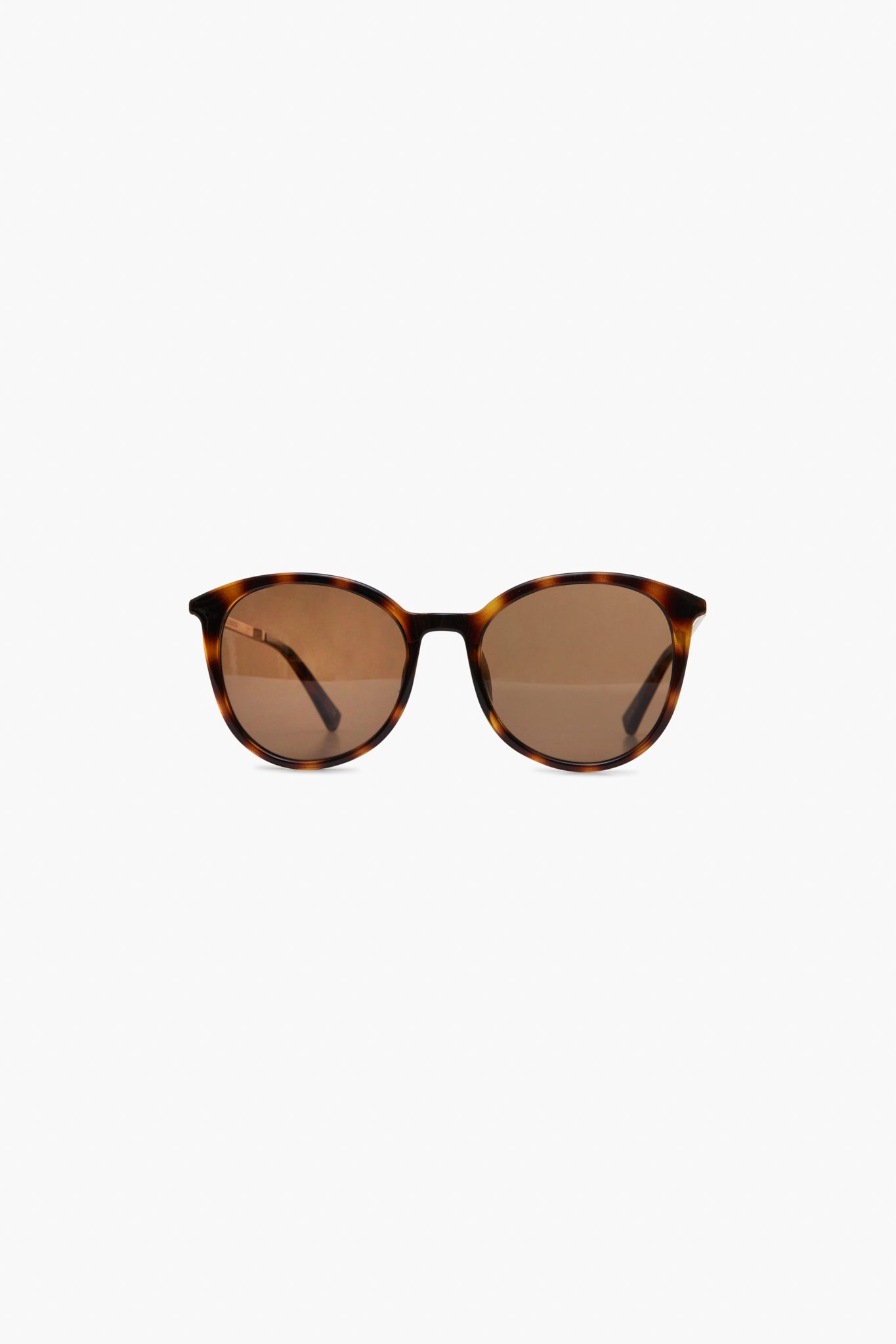 A pair of Le Specs sunglasses with brown tortoise frames, round polarized lenses, and thin arms.