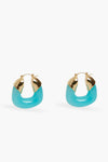 Lizzie Fortunato gold-plated hoop earrings with turquoise accents and a hinged clasp, displayed in a minimalist setting.