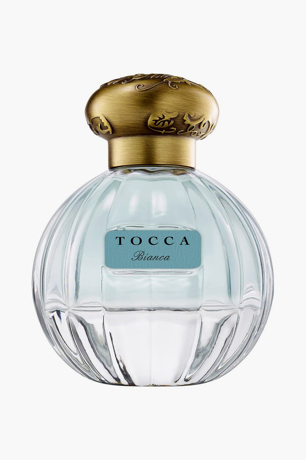 A clear glass bottle of Tocca Bianca perfume with a gold cap and blue label, offering a fresh floral scent accented by hints of green tea.