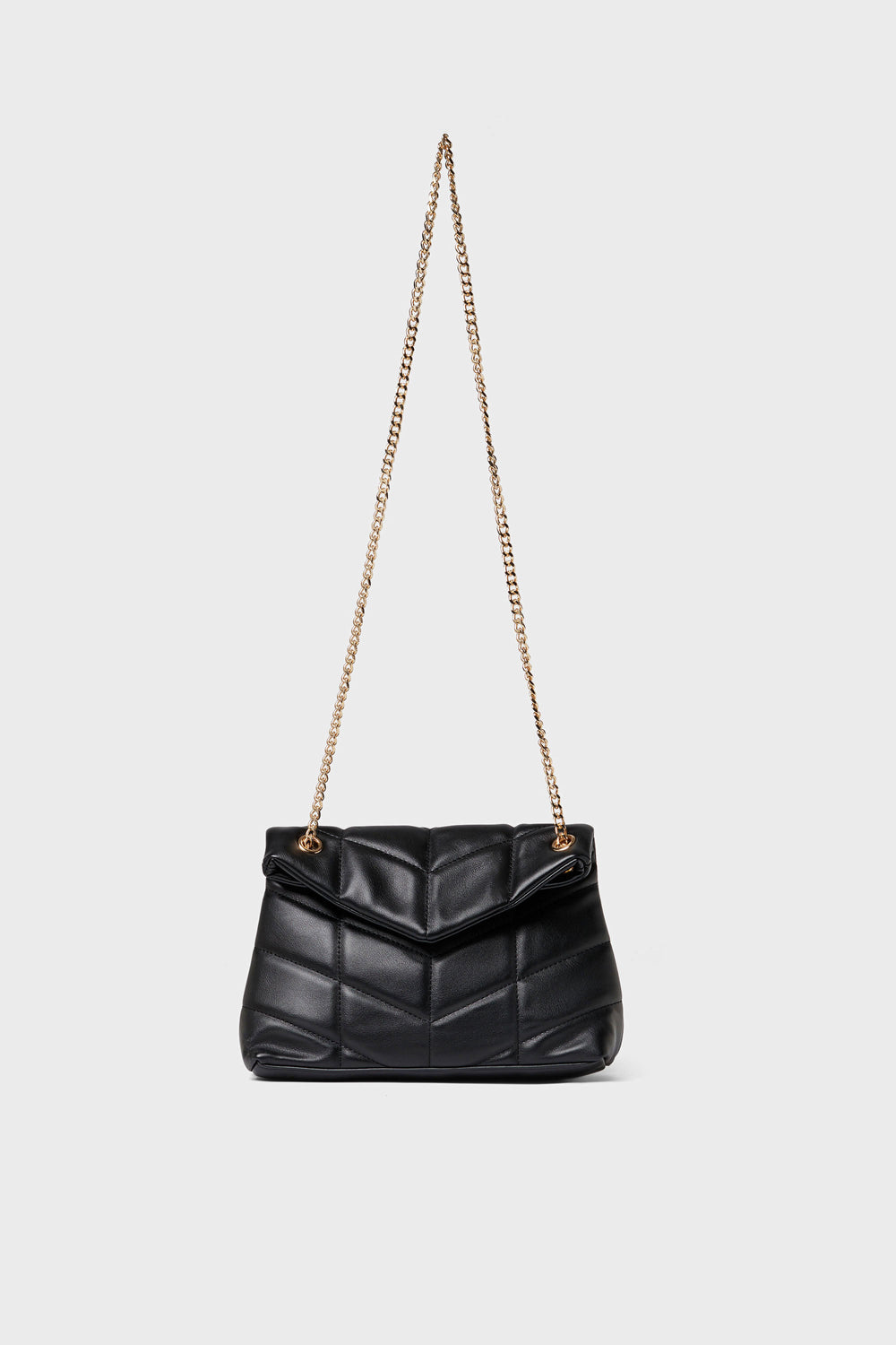 Urban Expressions black quilted crossbody bag made from vegan leather with a gold chain strap, elegantly displayed.