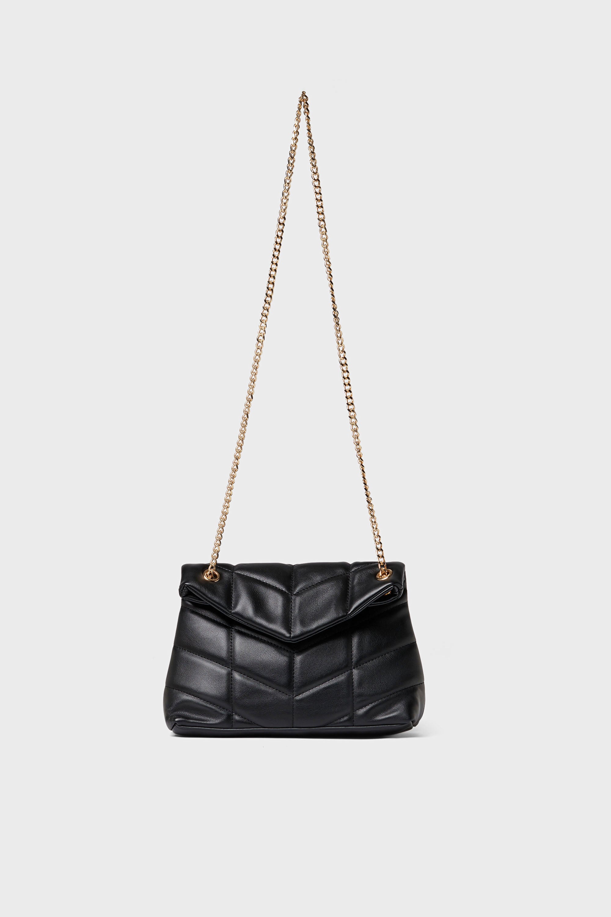 Urban Expressions black quilted crossbody bag made from vegan leather with a gold chain strap, elegantly displayed.