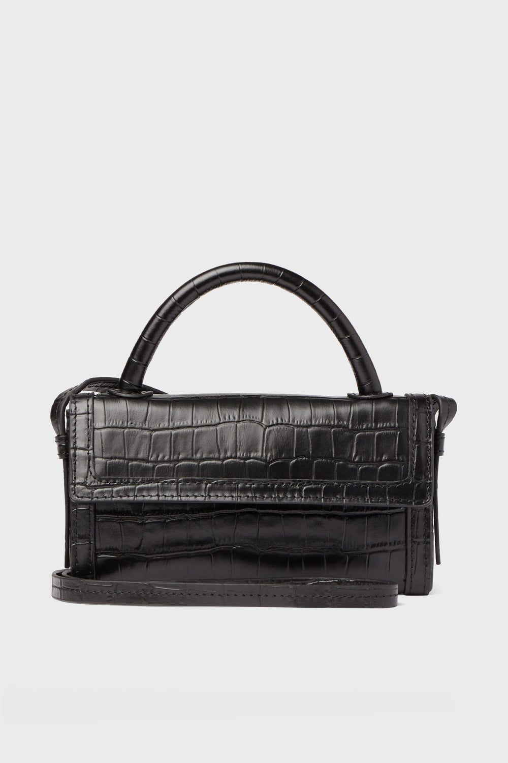 The Neely & Chloe Black Croc Phone Crossbody is a compact black handbag in croc-embossed leather, featuring a top handle and long shoulder strap—ideal for carrying your essentials in style.