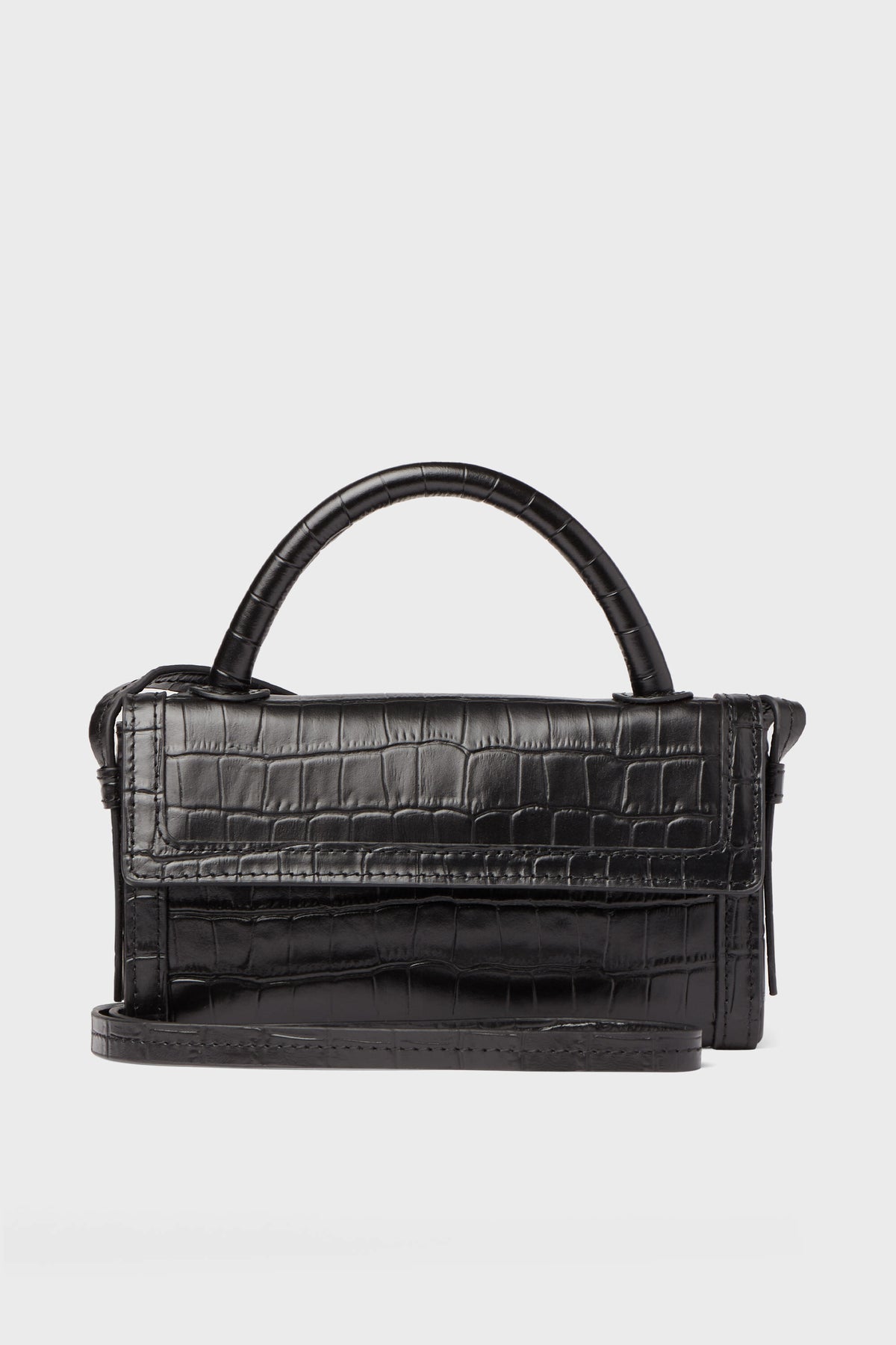 The Neely & Chloe Black Croc Phone Crossbody is a compact black handbag in croc-embossed leather, featuring a top handle and long shoulder strap—ideal for carrying your essentials in style.