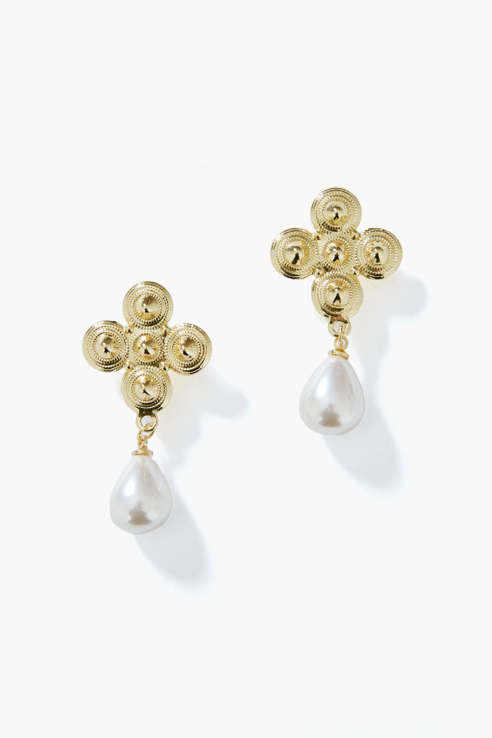 These gold pearl earrings by Petit Moments feature a four-circle floral design with a teardrop pearl drop, crafted by a female-owned Los Angeles jewelry brand.