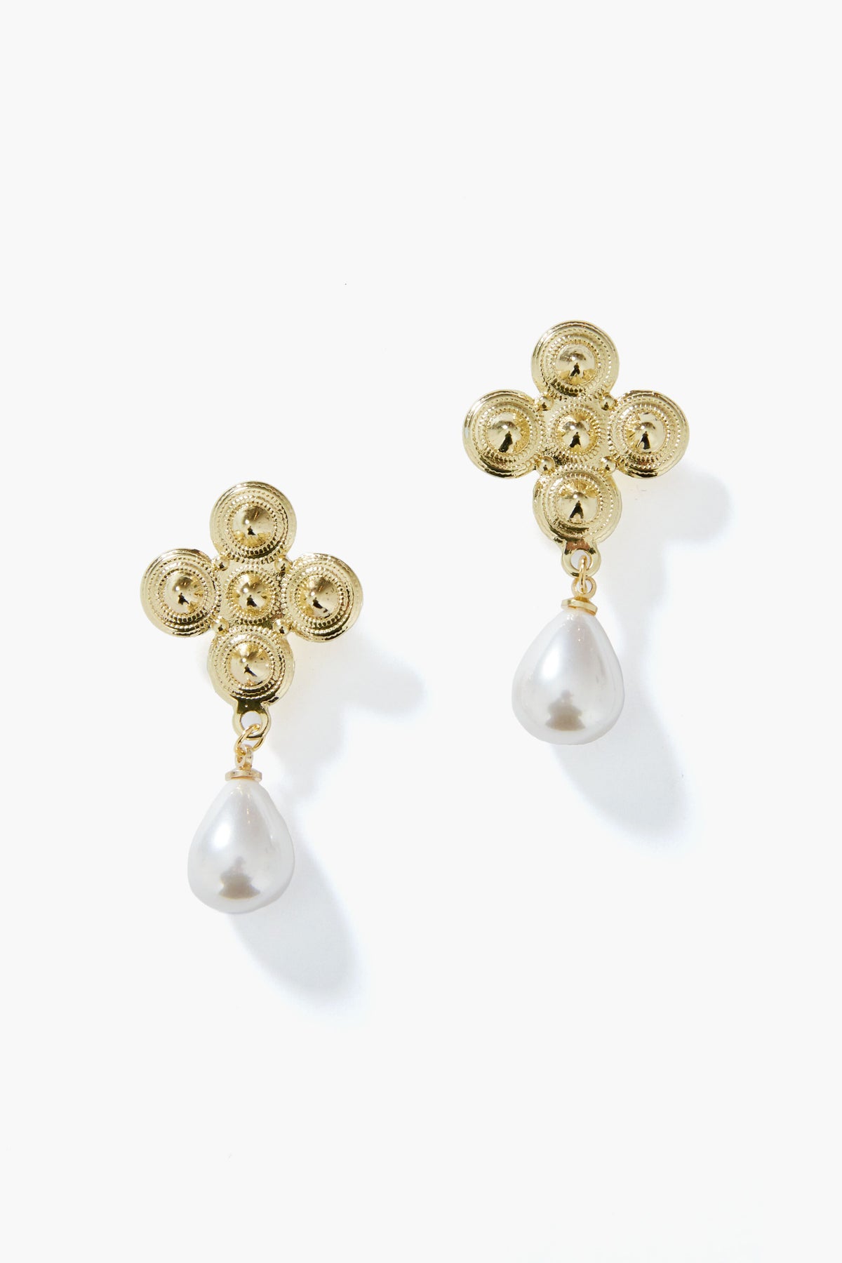These gold pearl earrings by Petit Moments feature a four-circle floral design with a teardrop pearl drop, crafted by a female-owned Los Angeles jewelry brand.