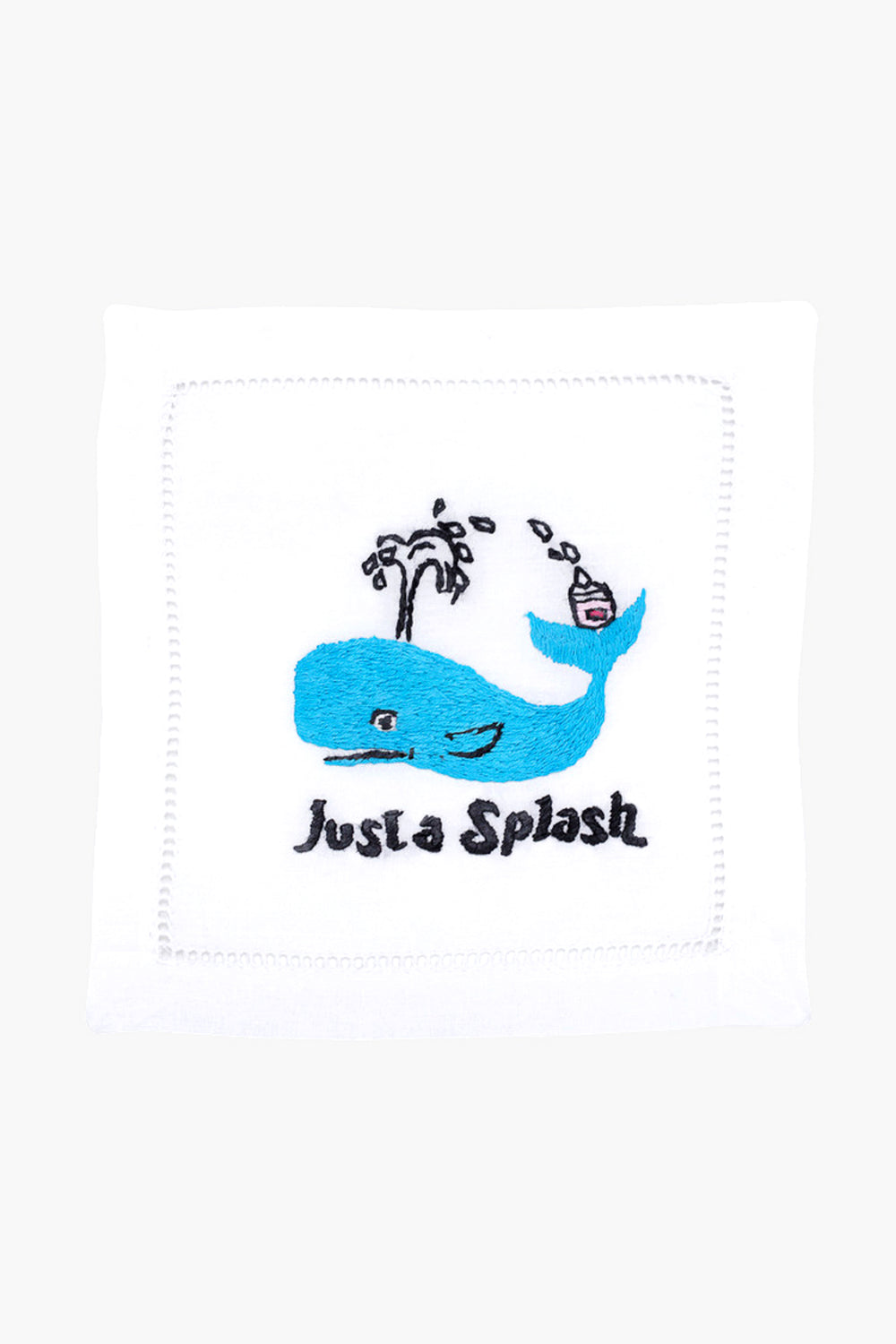 The August Morgan white cloth napkin features an embroidered blue whale, water spout, cocktail, and "Just a Splash" text—ideal as cocktail party decor or a charming hostess gift.