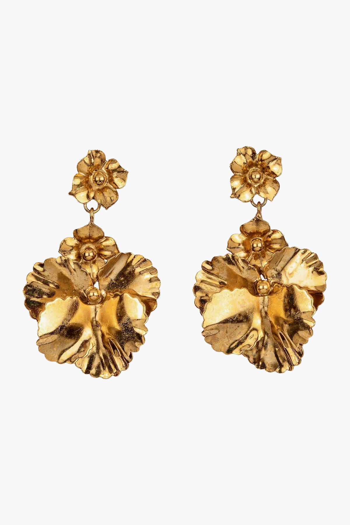 The Gold Samara Earrings by Jennifer Behr are luxury accessories, handmade in New York, featuring a small flower stud and a larger textured flower pendant that dangles below.