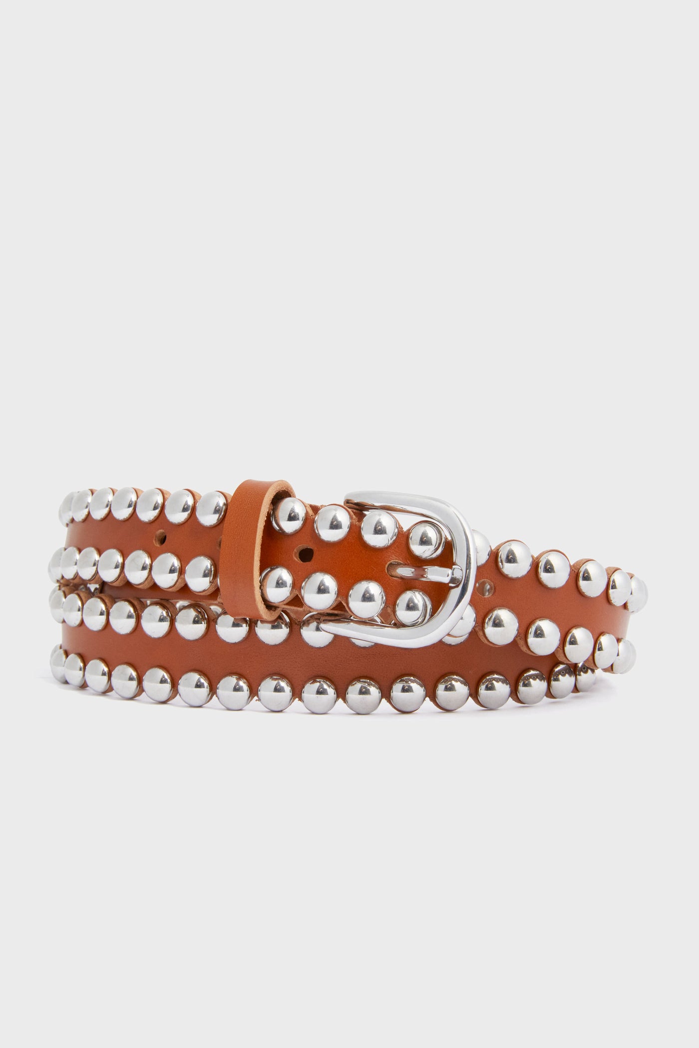 A neatly coiled Isabel Marant brown leather hip belt featuring three rows of large silver studs and a silver buckle.
