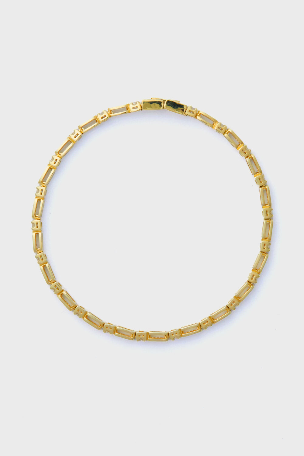 A fine jewelry piece from Tuckernuck Fine Jewelry, this gold necklace features a secure clasp and pairs beautifully with a 14k gold bracelet.