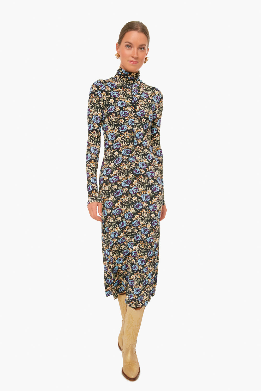 A woman wearing a RHODE floral midi dress with long sleeves and a high neck, paired with light-colored knee-high boots.
