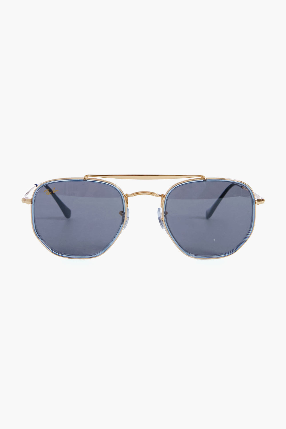 Ray-Ban gold-framed aviator sunglasses feature gradient blue-tinted lenses and hexagonal metallic frames.