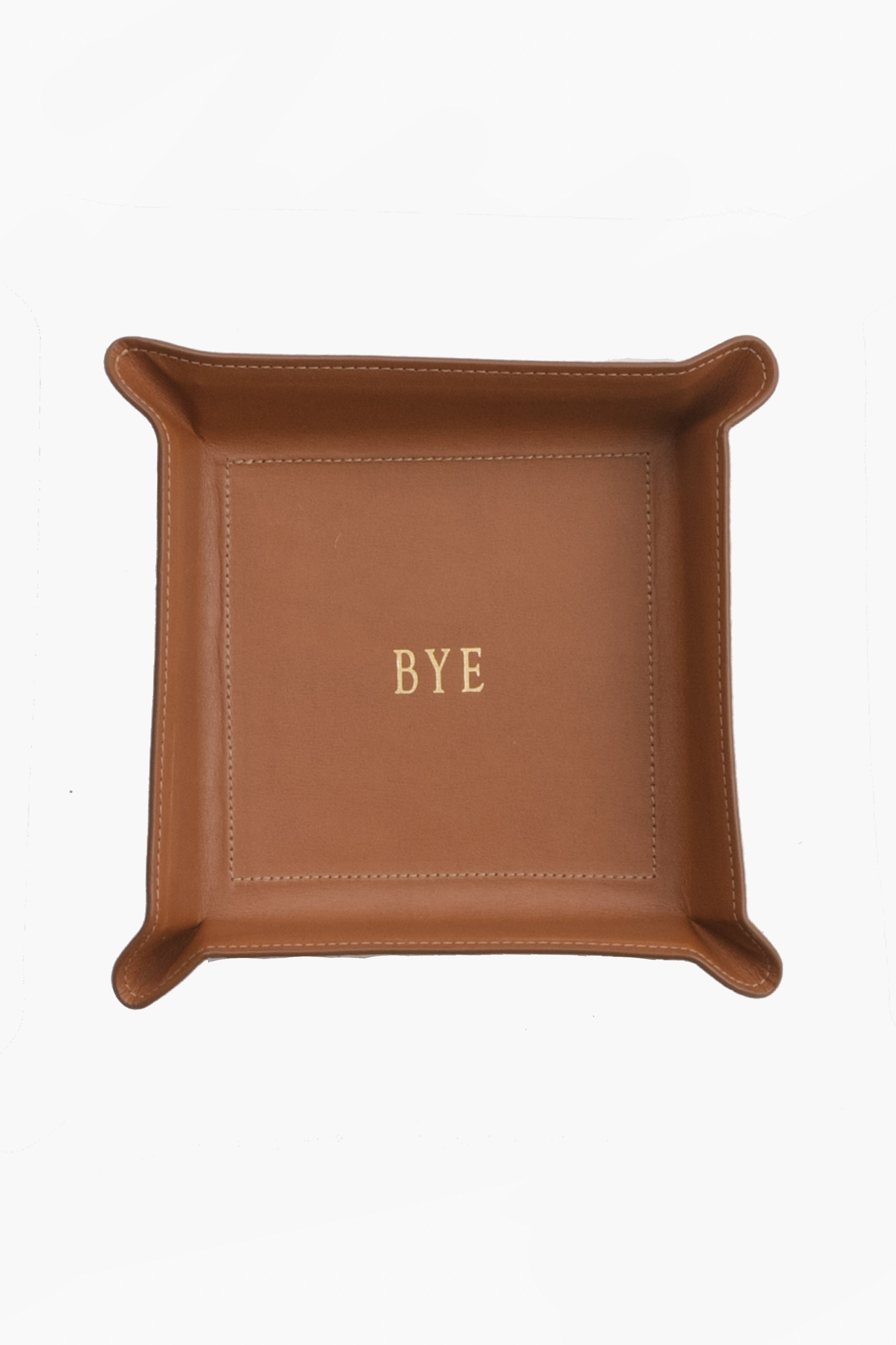 A brown Vachetta leather catchall tray by Graphic Image, featuring “BYE” embossed in gold at the center—ideal as a unique personalized gift.