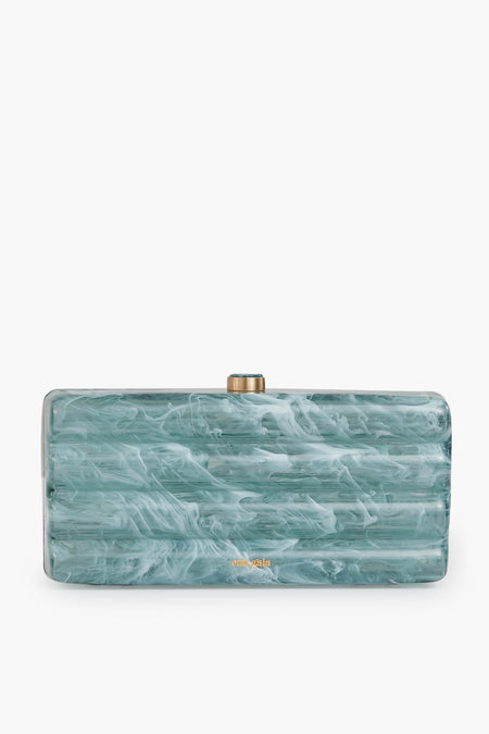 The Cult Gaia Seaspray Enid Clutch is a rectangular, blue-green marble-patterned accessory with a gold clasp and small gold logo—a unique statement piece.