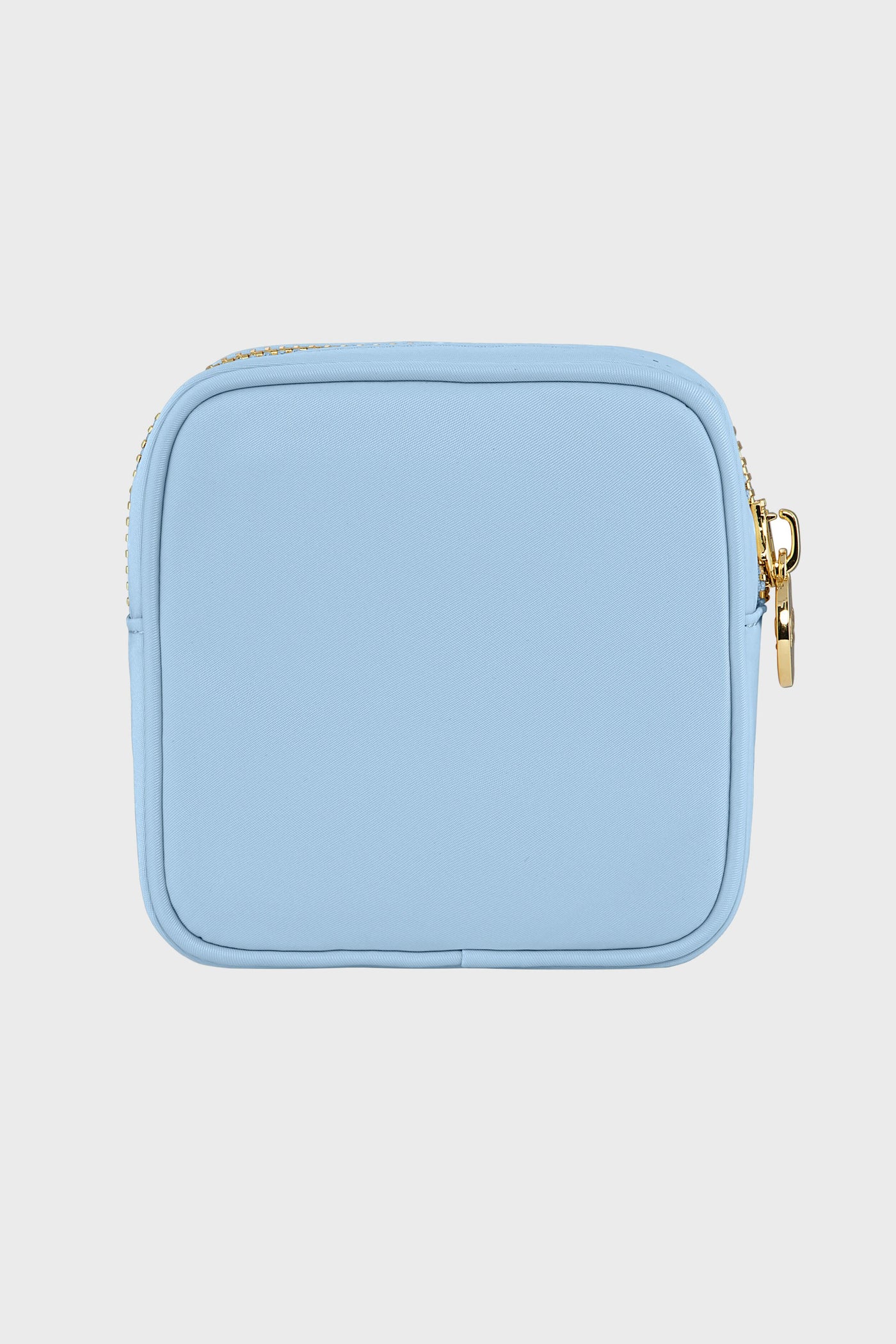 The Stoney Clover Lane light blue rectangular mini pouch features a gold zipper—ideal for travel accessories or as a clear makeup bag.