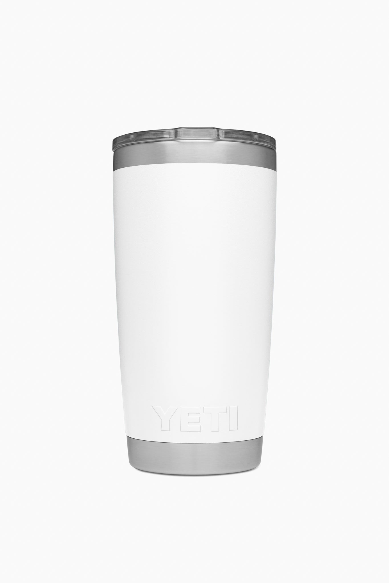 A YETI Rambler tumbler in white stainless steel stands upright, featuring a silver lid and base that showcase its vacuum insulated design.