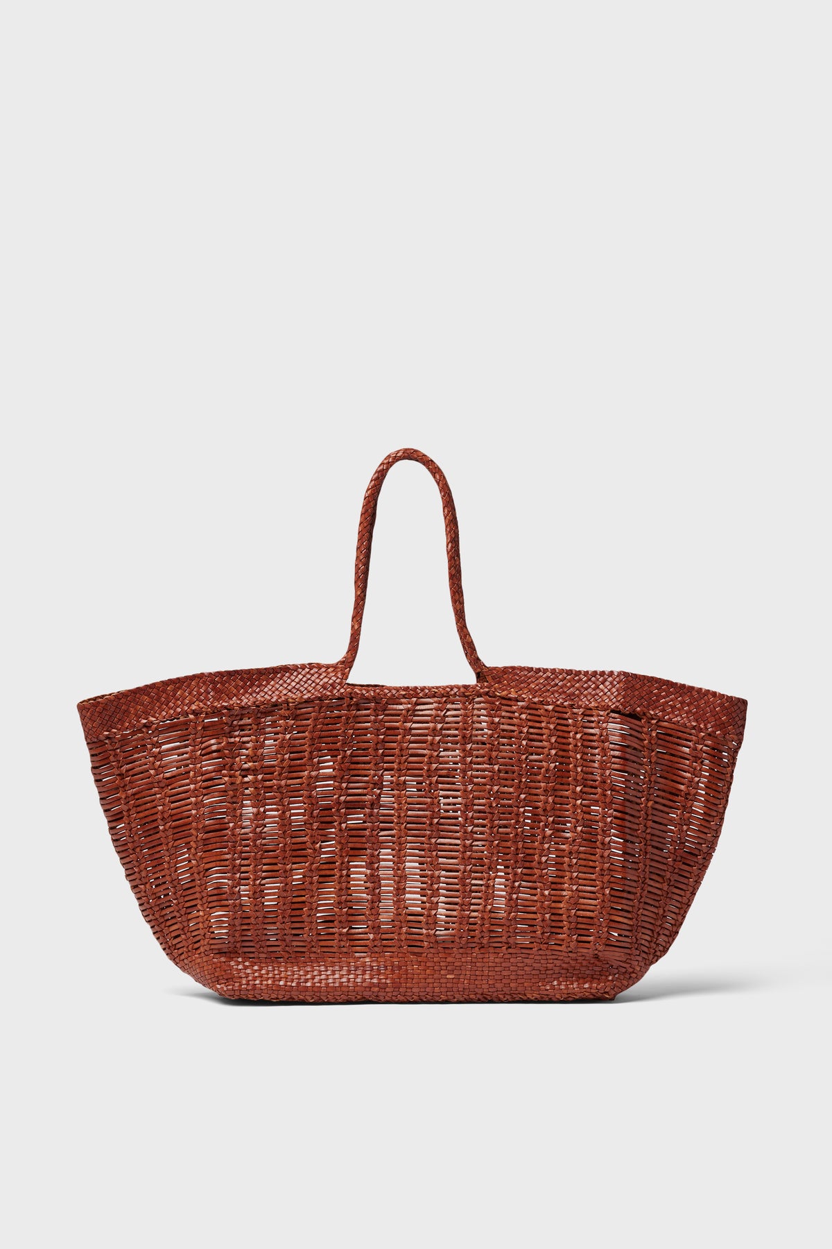 The Dragon Diffusion tote is a large, brown, handwoven bag with two handles, expertly crafted from buffalo calf leather.