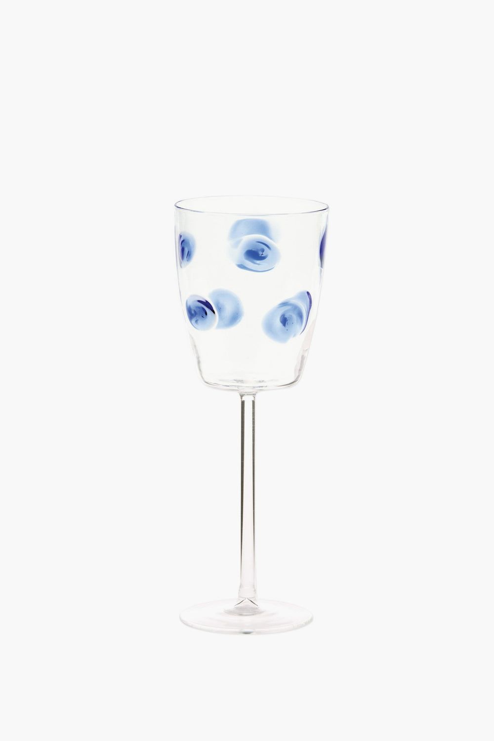Vietri handmade wine glass featuring blue circular swirl patterns evenly distributed on the bowl, inspired by Italian barware.