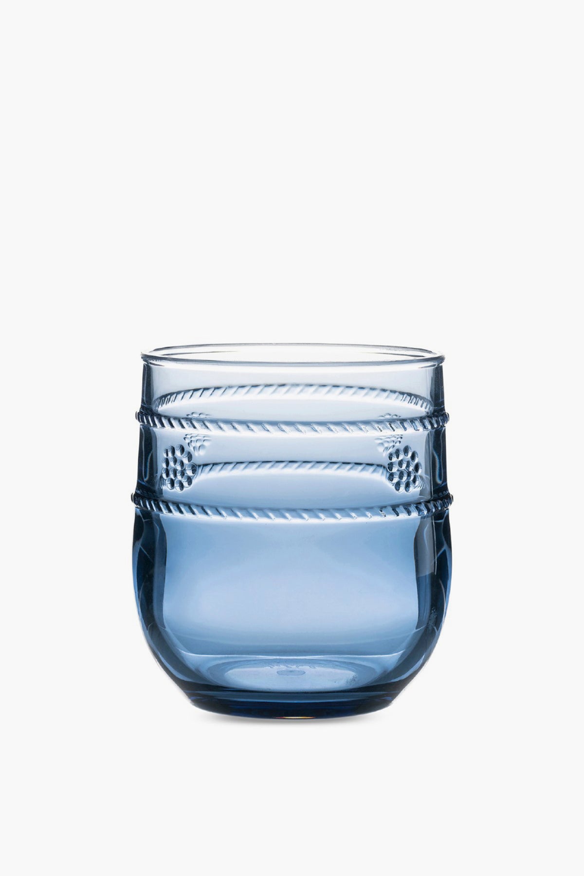The Juliska Al Fresco tumbler is blue, made from BPA-free acrylic, and features a rounded base with textured horizontal bands near the top. It's dishwasher safe for easy cleaning.
